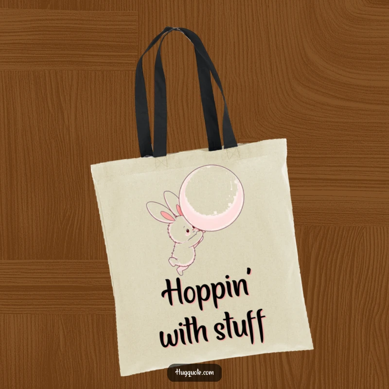 Funny tote bag with a fluffy bunny character attempting to hug a large, floating balloon, great for carrying essentials.